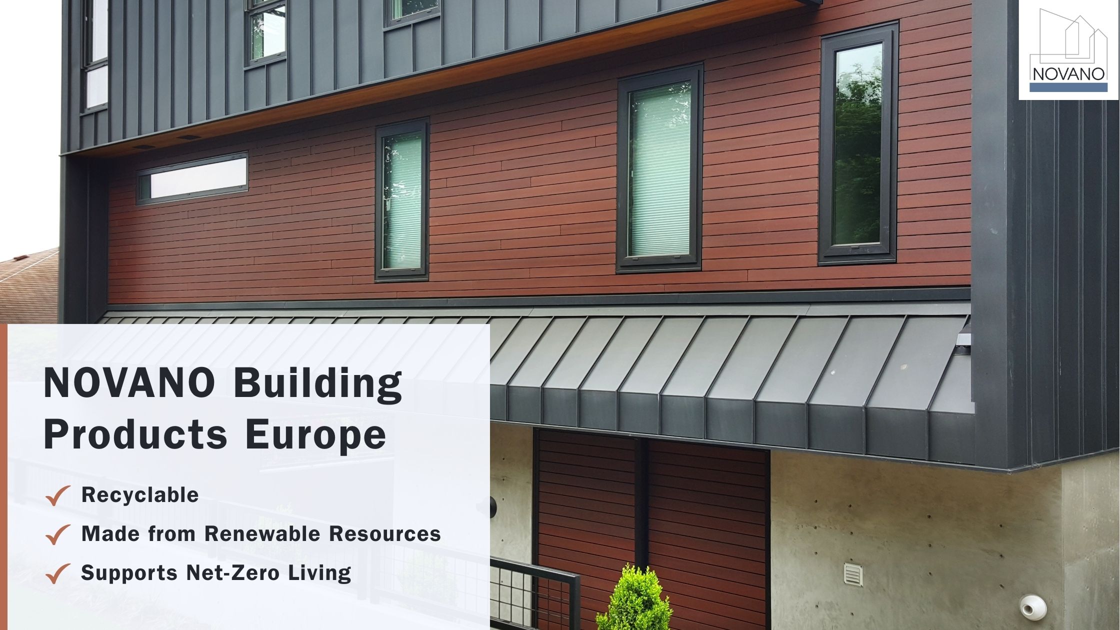 European multi-story building with red composite siding with text overlay: “Novano: Recyclable, Renewable Resources, Net-Zero Living”