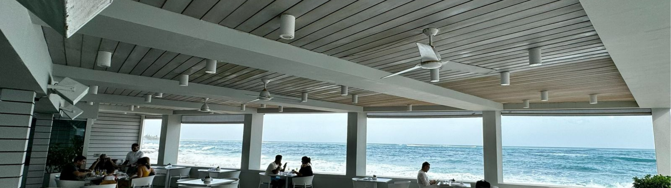 Composite ceiling system installed in a coastal hospitality venue, providing moisture-resistant performance and a refined architectural finish